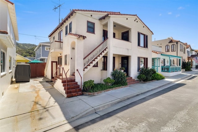 308 Catalina Ave, Avalon, CA 90704 - view of front of property with a tile roof and stucco siding