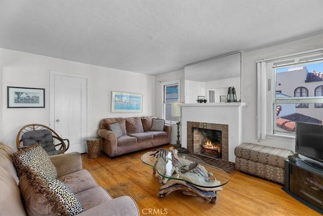 308 Catalina Ave, Avalon, CA 90704 - living room with wood finished floors and a fireplace