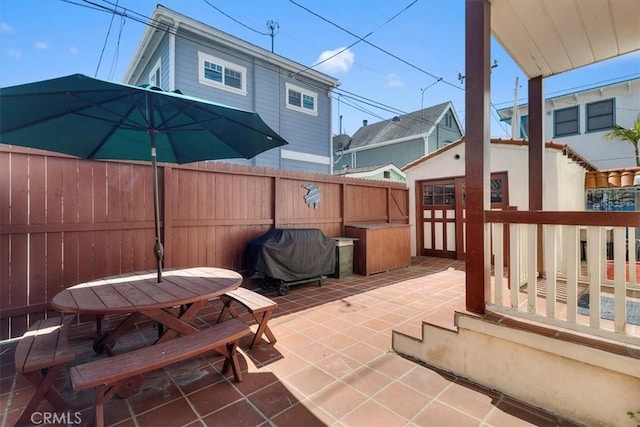 308 Catalina Ave, Avalon, CA 90704 - view of patio with outdoor dining area, area for grilling, an outdoor structure, and fence