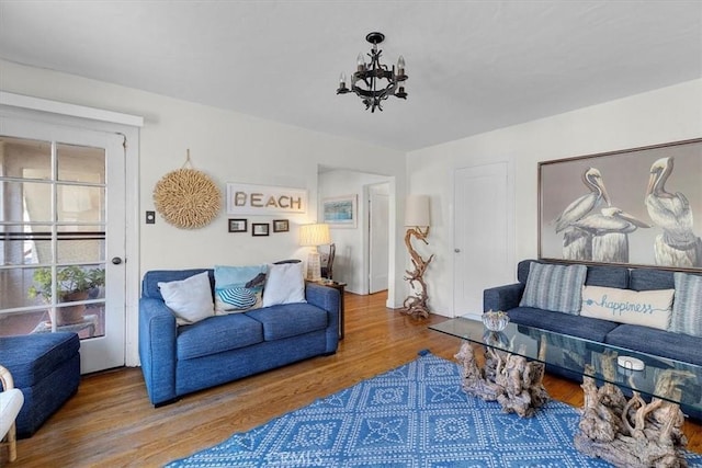 308 Catalina Ave, Avalon, CA 90704 - living room with a notable chandelier and wood finished floors