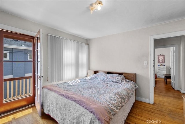 308 Catalina Ave, Avalon, CA 90704 - bedroom featuring multiple windows, wood finished floors, and baseboards
