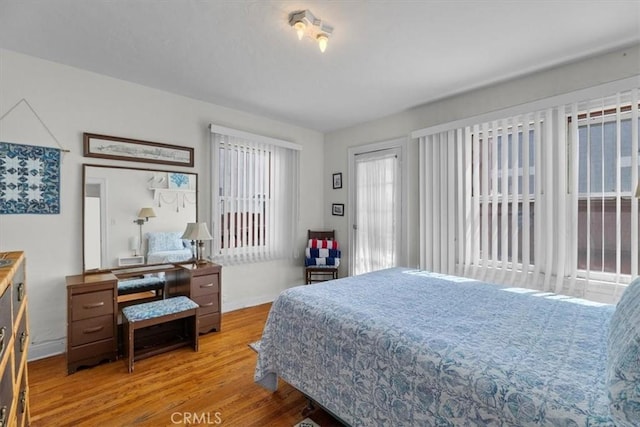 308 Catalina Ave, Avalon, CA 90704 - bedroom with wood finished floors and baseboards