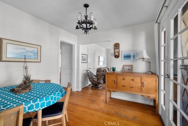 308 Catalina Ave, Avalon, CA 90704 - dining area with an inviting chandelier and light wood-type flooring