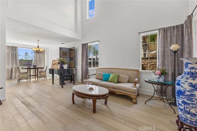 27669 Bluff Vista Way, Menifee, CA 92584 - living area featuring plenty of natural light, an inviting chandelier, and light wood-style flooring