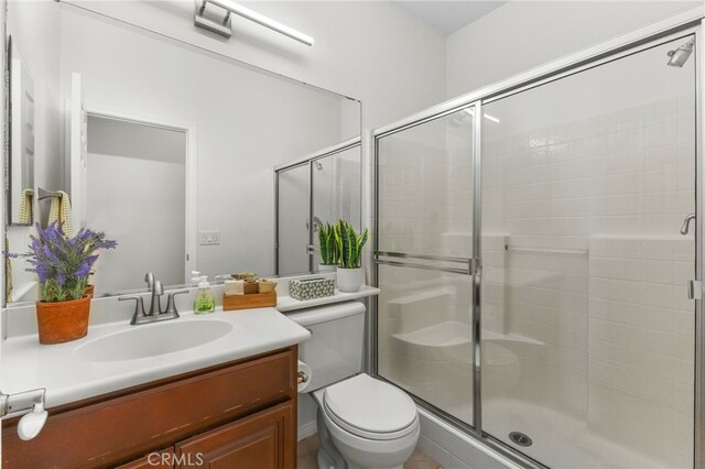 27669 Bluff Vista Way, Menifee, CA 92584 - full bathroom with vanity, a shower stall, and toilet