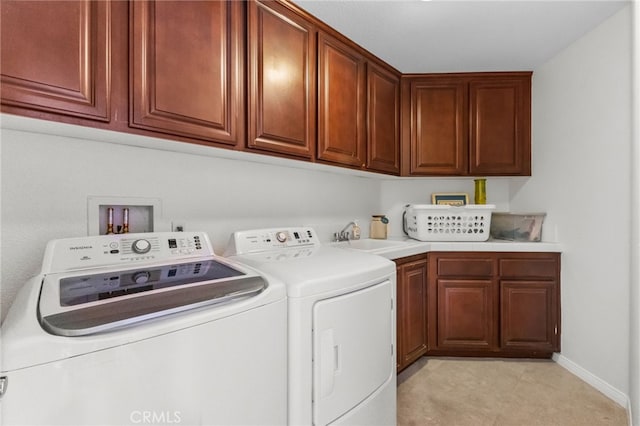 27669 Bluff Vista Way, Menifee, CA 92584 - clothes washing area with washer and clothes dryer, cabinet space, baseboards, and a sink