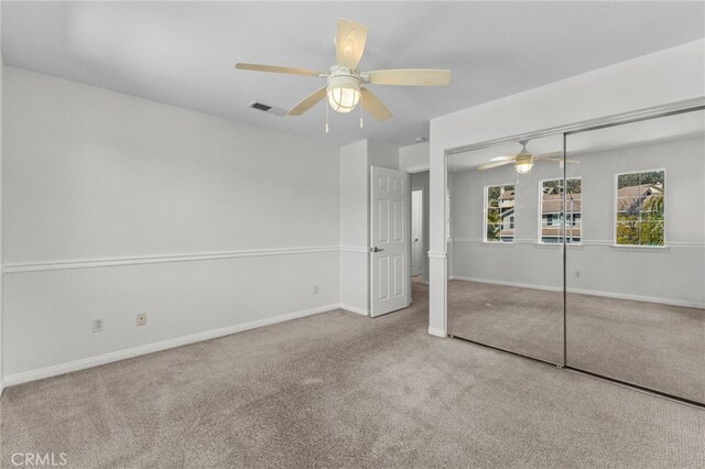 27669 Bluff Vista Way, Menifee, CA 92584 - unfurnished bedroom with visible vents, baseboards, a closet, and carpet flooring