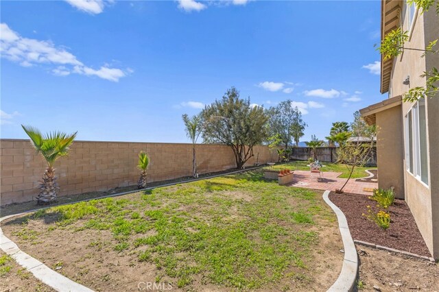 27669 Bluff Vista Way, Menifee, CA 92584 - view of yard featuring a patio area and a fenced backyard