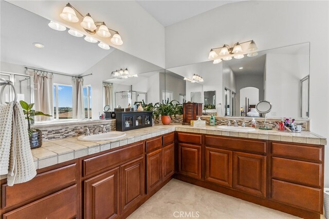 27669 Bluff Vista Way, Menifee, CA 92584 - full bath featuring double vanity, lofted ceiling, and a sink