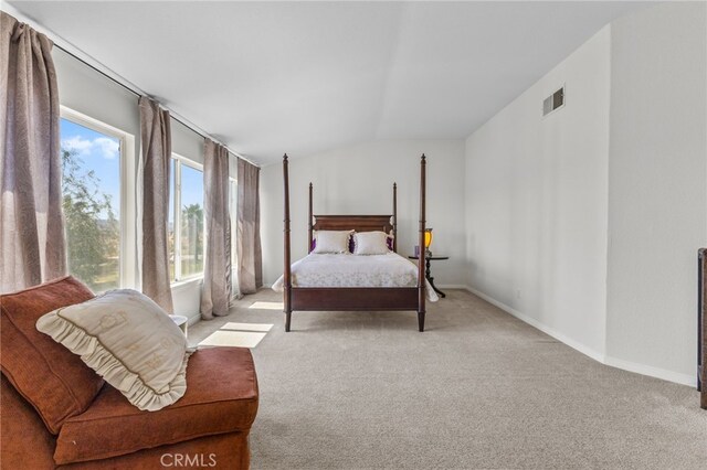 27669 Bluff Vista Way, Menifee, CA 92584 - bedroom with visible vents, baseboards, lofted ceiling, and carpet