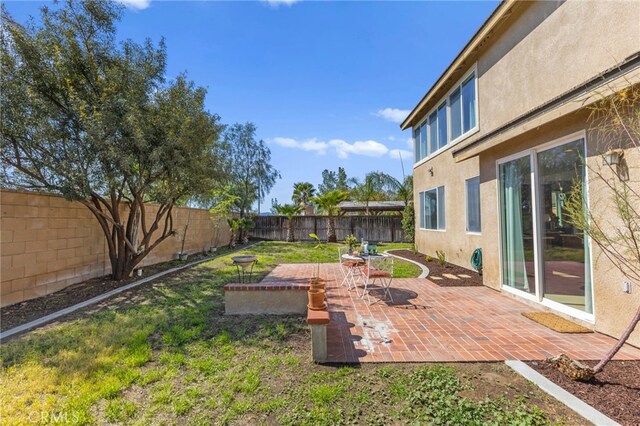 27669 Bluff Vista Way, Menifee, CA 92584 - view of yard featuring a patio area and a fenced backyard