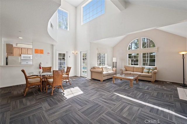 4591 Warner Ave Unit 101, Huntington Beach, CA 92649 - living room with dark carpet and high vaulted ceiling