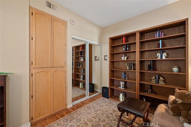 4591 Warner Ave Unit 101, Huntington Beach, CA 92649 - living area featuring light wood finished floors and baseboards