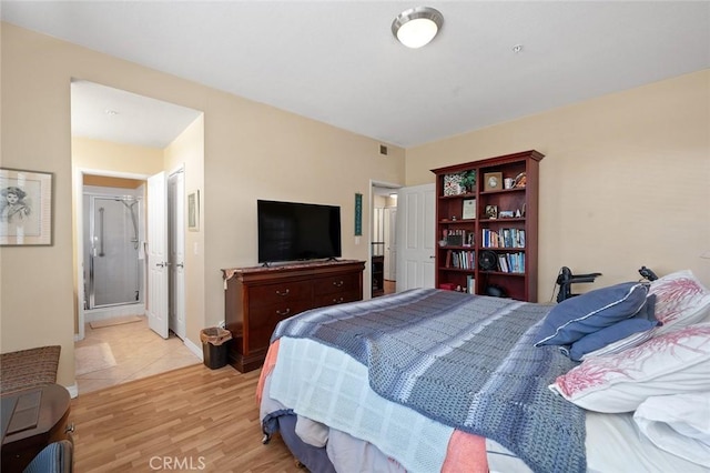 4591 Warner Ave Unit 101, Huntington Beach, CA 92649 - bedroom with light wood finished floors and baseboards