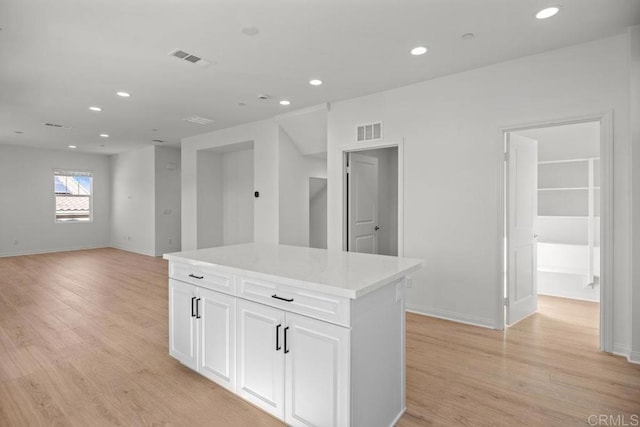 8624 Amherst St, Santee, CA 92071 - kitchen featuring visible vents, recessed lighting, white cabinetry, and light wood-type flooring