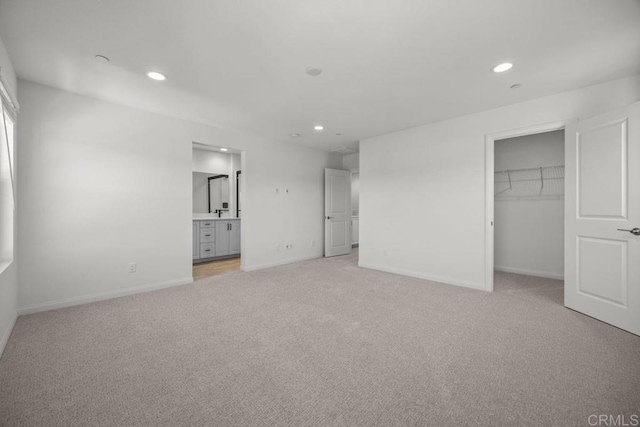 8624 Amherst St, Santee, CA 92071 - unfurnished bedroom featuring light carpet, recessed lighting, a walk in closet, and baseboards