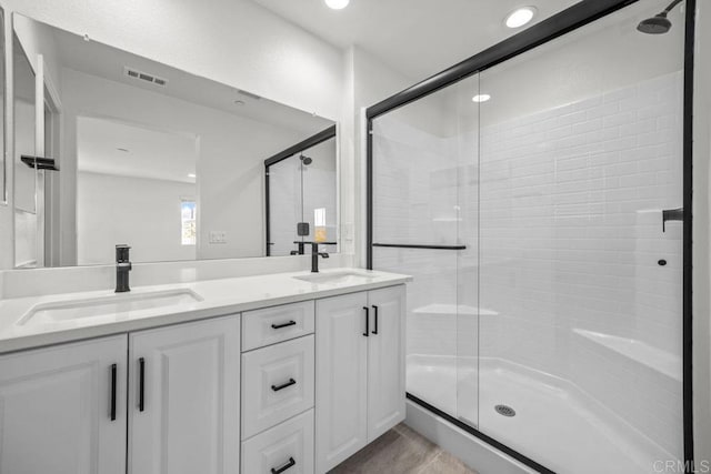 8624 Amherst St, Santee, CA 92071 - full bath with a sink, visible vents, a stall shower, and double vanity
