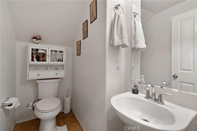 27571 Darrington Ave Unit 2, Murrieta, CA 92562 - half bathroom with tile patterned floors and vaulted ceiling
