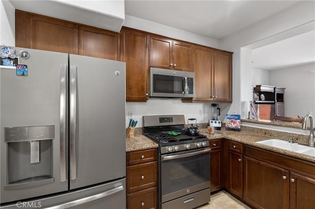 27571 Darrington Ave Unit 2, Murrieta, CA 92562 - kitchen featuring appliances with stainless steel finishes and light stone counters