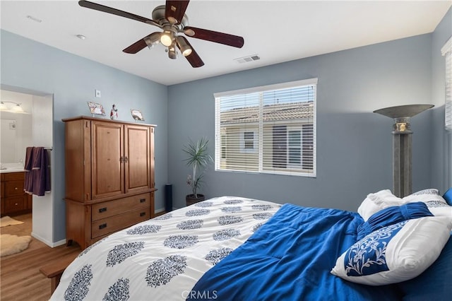 27571 Darrington Ave Unit 2, Murrieta, CA 92562 - bedroom with wood finished floors, connected bathroom, and a ceiling fan