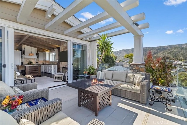 133 Upper Terrace Rd, Avalon, CA 90704 - view of patio / terrace with an outdoor living space with a fire pit and a pergola