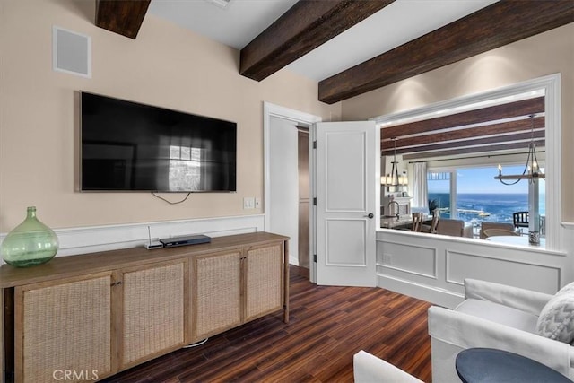133 Upper Terrace Rd, Avalon, CA 90704 - living area featuring a chandelier, visible vents, beamed ceiling, and dark wood-style flooring