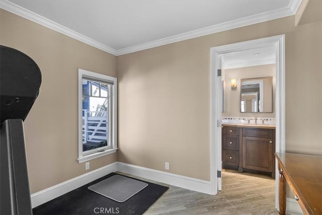 133 Upper Terrace Rd, Avalon, CA 90704 - interior space featuring a sink, light wood-type flooring, baseboards, and crown molding