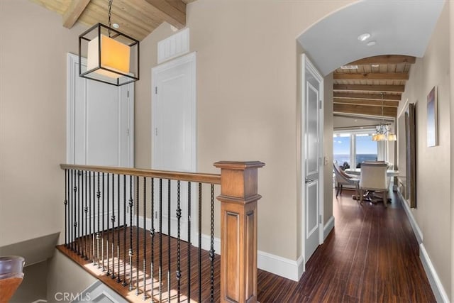 133 Upper Terrace Rd, Avalon, CA 90704 - hallway featuring lofted ceiling with beams, wood finished floors, arched walkways, baseboards, and wood ceiling