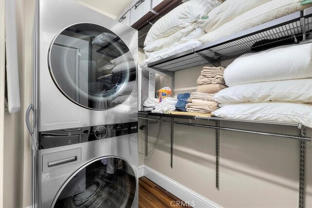 133 Upper Terrace Rd, Avalon, CA 90704 - washroom featuring laundry area, dark wood-style floors, and stacked washer and clothes dryer