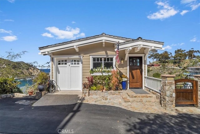 133 Upper Terrace Rd, Avalon, CA 90704 - view of front of house with a gate and a water view