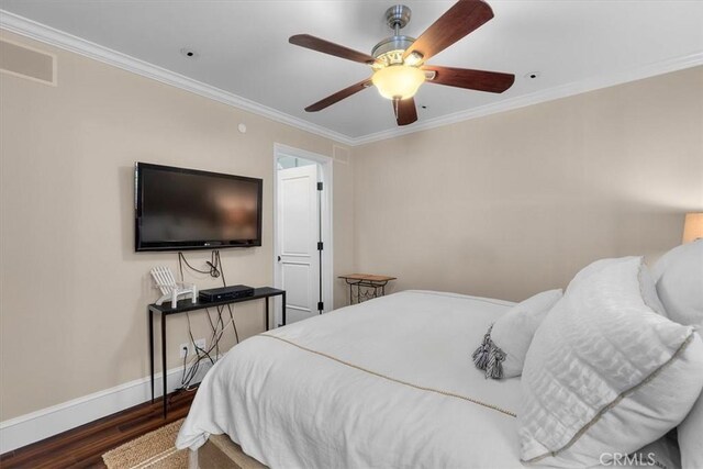 133 Upper Terrace Rd, Avalon, CA 90704 - bedroom with ornamental molding, ceiling fan, baseboards, and wood finished floors