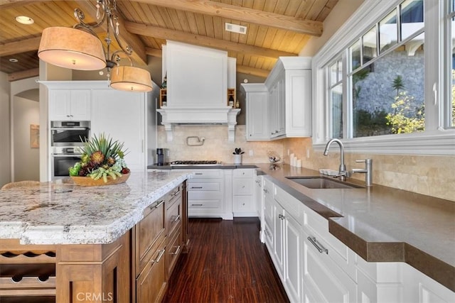 133 Upper Terrace Rd, Avalon, CA 90704 - kitchen featuring visible vents, a sink, light stone counters, backsplash, and stainless steel appliances