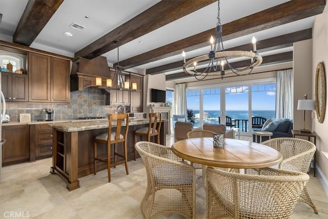 133 Upper Terrace Rd, Avalon, CA 90704 - dining space with visible vents, beam ceiling, and an inviting chandelier