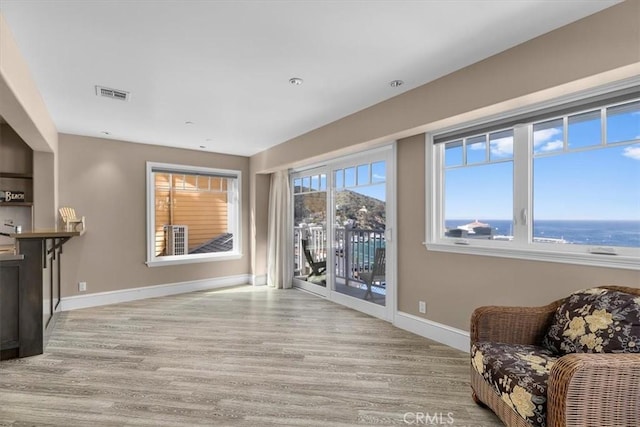 133 Upper Terrace Rd, Avalon, CA 90704 - living area with visible vents, baseboards, and wood finished floors
