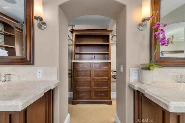 133 Upper Terrace Rd, Avalon, CA 90704 - bathroom with baseboards, tasteful backsplash, and vanity