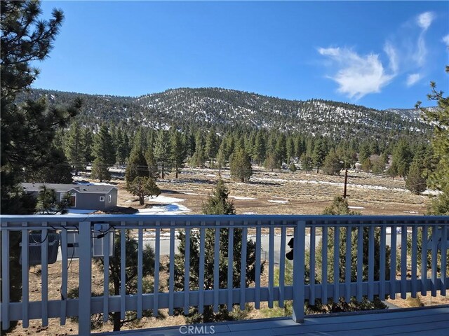 view of mountain feature featuring a forest view