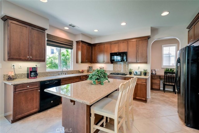 26718 Cactus Creek Way, Menifee, CA 92586 - kitchen featuring black appliances, a sink, plenty of natural light, a kitchen bar, and recessed lighting