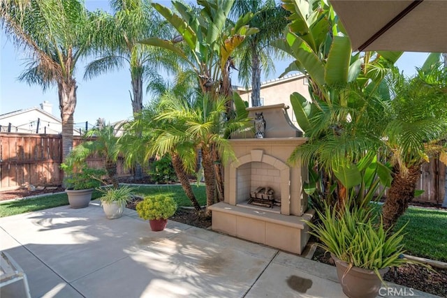 26718 Cactus Creek Way, Menifee, CA 92586 - view of patio / terrace featuring a fireplace and fence