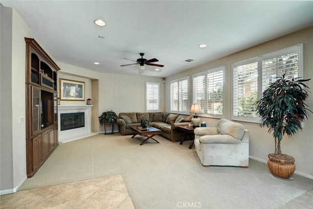 26718 Cactus Creek Way, Menifee, CA 92586 - living room featuring light carpet, a glass covered fireplace, baseboards, recessed lighting, and a ceiling fan