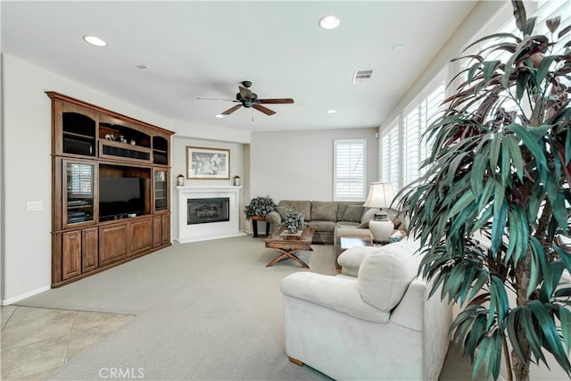 26718 Cactus Creek Way, Menifee, CA 92586 - living room with a ceiling fan, recessed lighting, a glass covered fireplace, and carpet