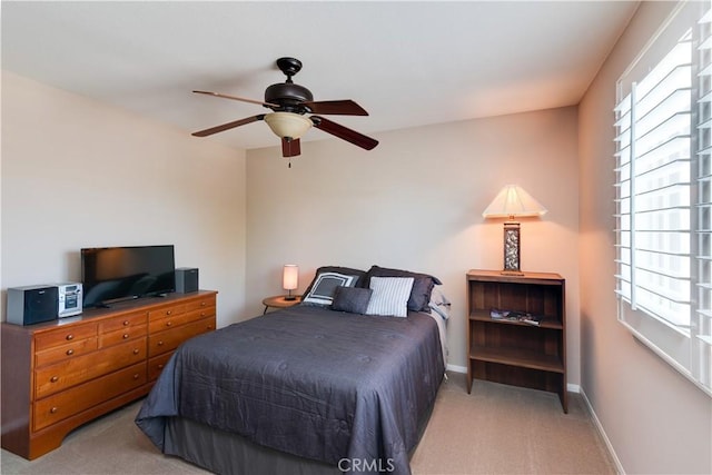 26718 Cactus Creek Way, Menifee, CA 92586 - bedroom with light carpet, multiple windows, baseboards, and a ceiling fan
