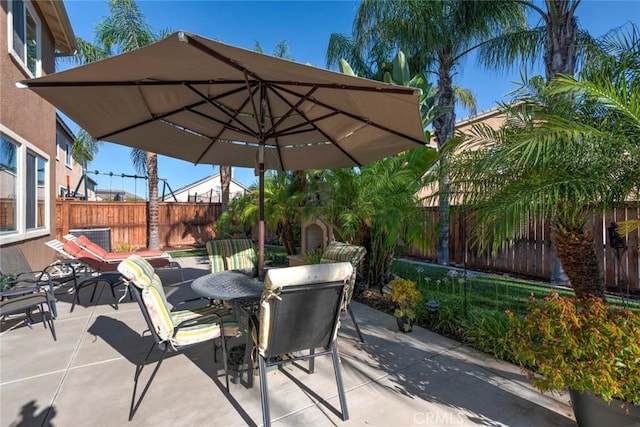 26718 Cactus Creek Way, Menifee, CA 92586 - view of patio featuring outdoor dining space and a fenced backyard