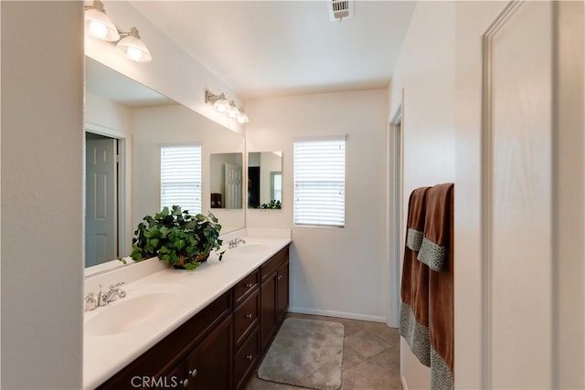 26718 Cactus Creek Way, Menifee, CA 92586 - full bathroom with healthy amount of natural light, double vanity, tile patterned floors, and baseboards