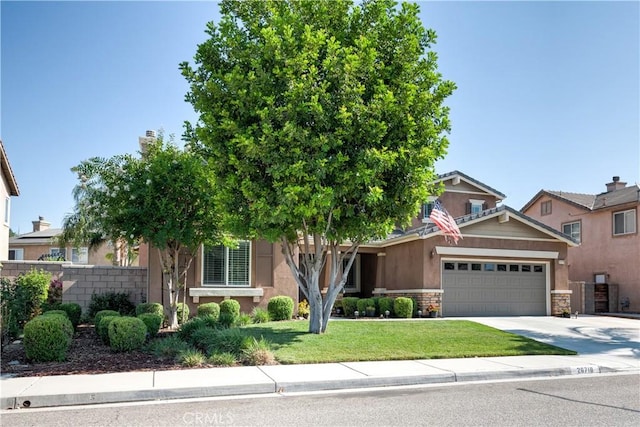 26718 Cactus Creek Way, Menifee, CA 92586 - view of front facade featuring a garage, stone siding, driveway, and stucco siding