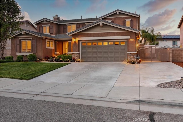 26718 Cactus Creek Way, Menifee, CA 92586 - craftsman house with a gate, stone siding, concrete driveway, and an attached garage