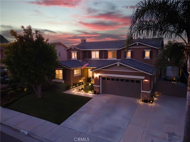 26718 Cactus Creek Way, Menifee, CA 92586 - view of front of home with concrete driveway, a tiled roof, an attached garage, and stone siding