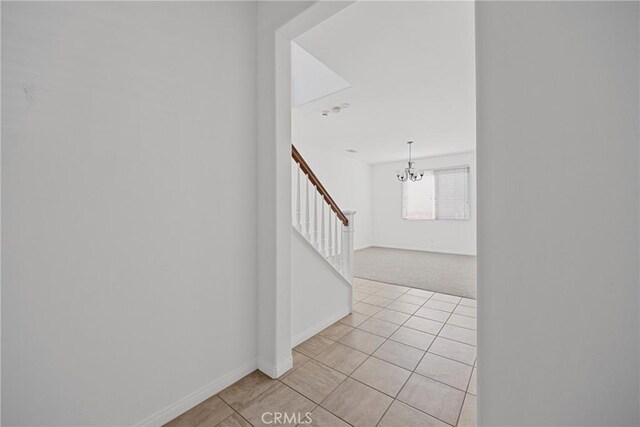 34135 Crenshaw St, Beaumont, CA 92223 - stairs featuring a chandelier, tile patterned floors, and carpet floors