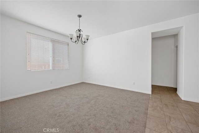 34135 Crenshaw St, Beaumont, CA 92223 - spare room with a chandelier and light colored carpet