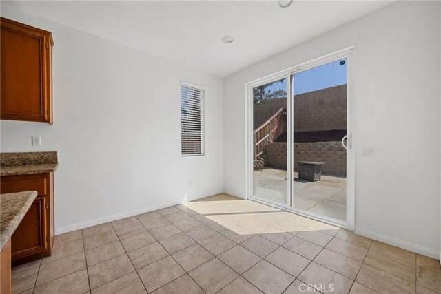 34135 Crenshaw St, Beaumont, CA 92223 - unfurnished dining area with light tile patterned floors and baseboards