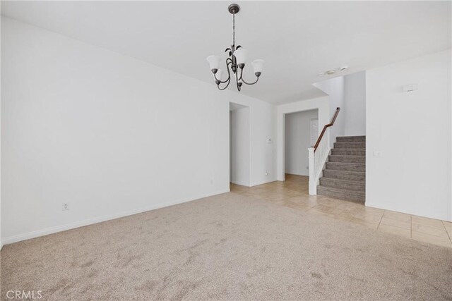 34135 Crenshaw St, Beaumont, CA 92223 - unfurnished living room featuring carpet flooring, stairs, and a chandelier